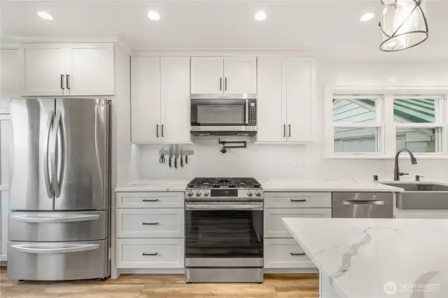 Fully updated kitchen also includes a gas range, recessed lighting and plenty of storage and work space.