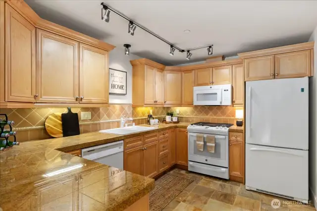 Large open kitchen with lots of counter and cupboard space.