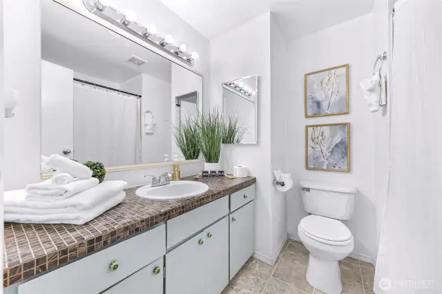 Spacious full bathroom with tub.