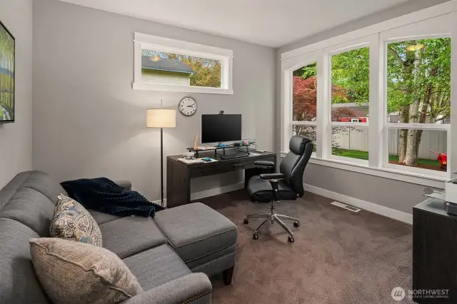 Front room office has gorgeous glass front doors and overlooks the garden