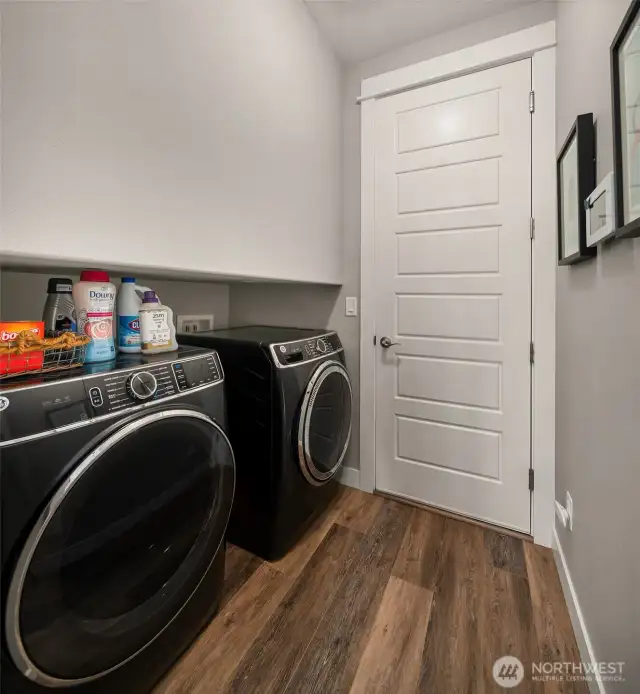 Main level laundry connects 3 car garage to the great room.