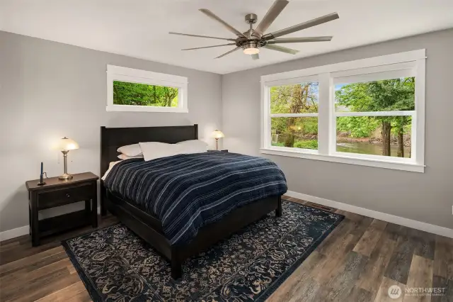 Main level Primary Suite is tucked into a private corner of this glorious home