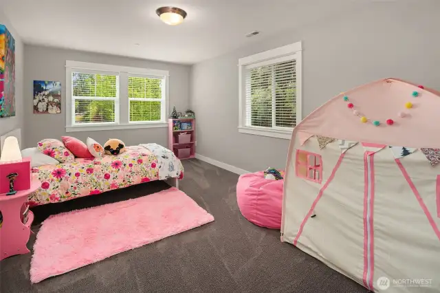 Corner bedroom is full of fun and light