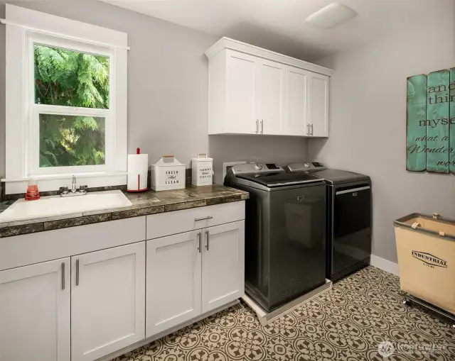 Upper level 2nd laundry room is spacious and strategically located