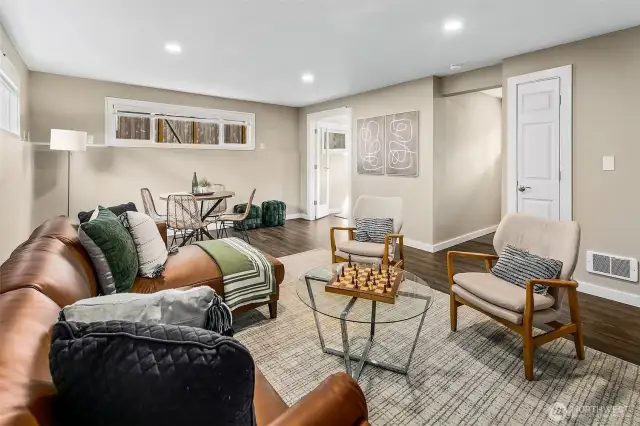 Lower level living room, showing access to the small lower level bedroom.