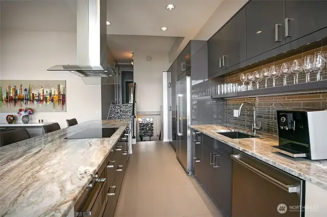 Stainless appliances and an induction cooktop,