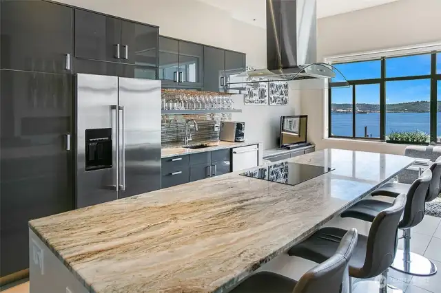 High-gloss cabinetry and a tasteful neutral palette in the kitchen.