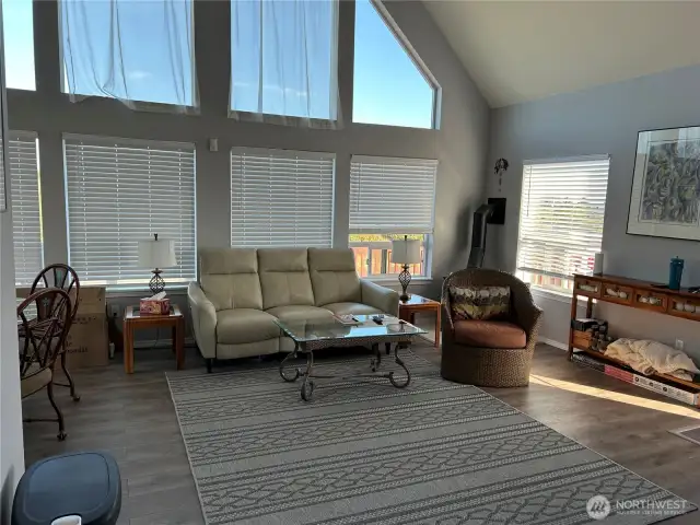 Beautiful new blinds move up and down just by manual lifting and open to territorial views to watch the deer  New laminate flooring in living room, kitchen and hall areas of the home.