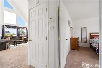 Split view of living room and primary bedroom