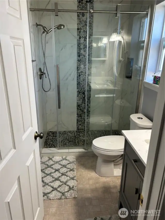 All new step in tiled shower and bathroom