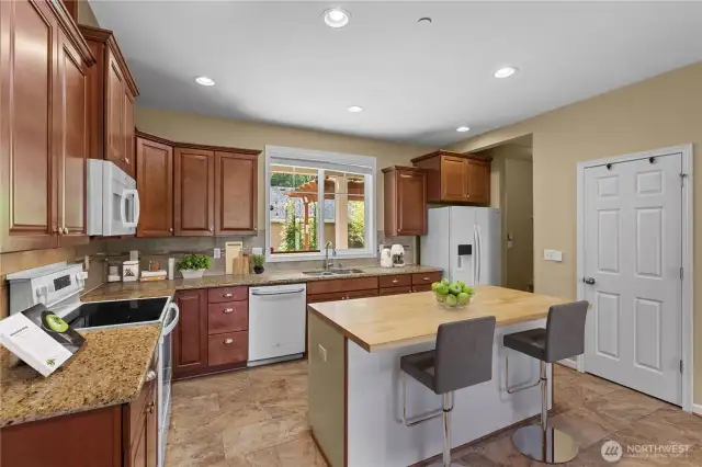 Kitchen w/Upgraded Cabinets w/Crown Molding and Pulls/Knobs. Breakfast Bar Island w/Outlets. Pantry keeps everything tidy! (Virtually Staged)