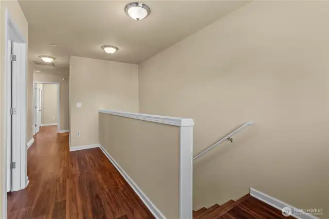 Upstairs and on the stairs you'll find more Laminate Hardwood Floors. (No Carpets in this home!)