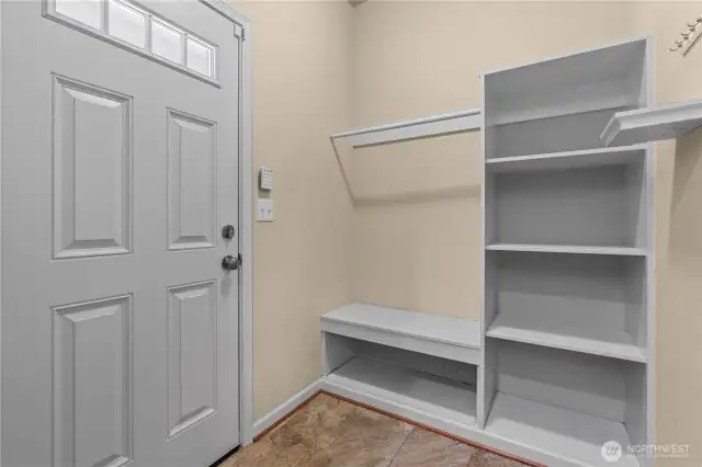 Mudroom w/Custom Built-Ins off the Kitchen leads to the Covered Back Patio. Great Location to store shoes, coats, etc.