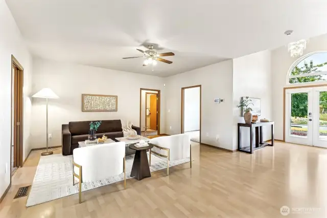 This rambler's great room is perfect for all of the memories ready to be made with it's spacious open concept layout and ceiling fan.