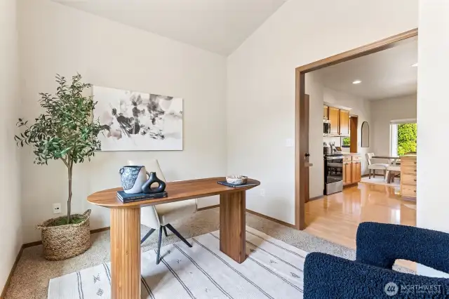 1 of 2 versatile flex rooms. Seen here as a staged office however owners of this home have used this room as a play room, office, den, tv room, library/reading nook, study, game room, movie room and more. Beautiful natural light pours in thru the large window. Wheelchair accesible. Ceiling fan too.