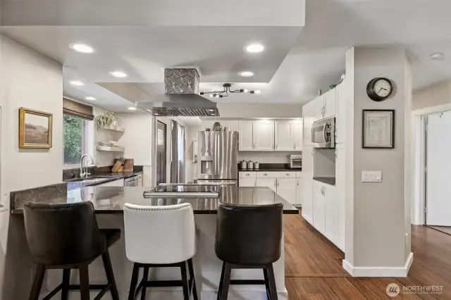 This well-appointed kitchen is designed for effortless entertaining, with ample storage, a reverse osmosis faucet, and countertop seating that keeps you connected to the conversation while you cook.