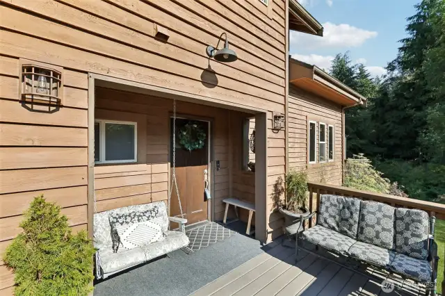 Inviting entrance complete with a porch swing.