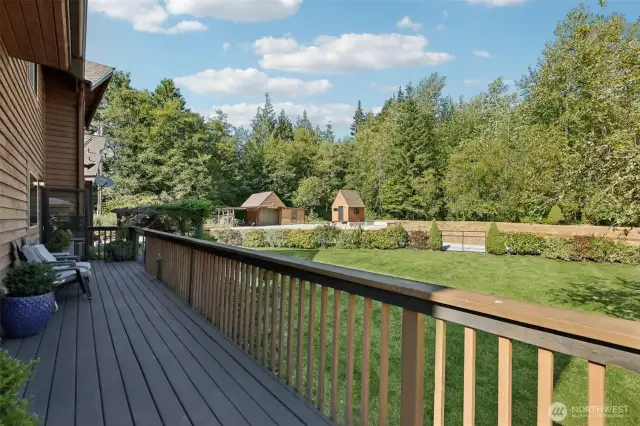 Looking out from the back deck towards one of the many garden spaces and outbuildings.