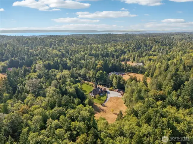 Aerial view that shows the cleared part of the property and the wooded area of your 4.72 acres.