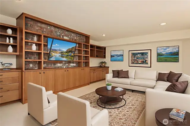 Lower level offers this spacious TV room with separate entrance from the outside.