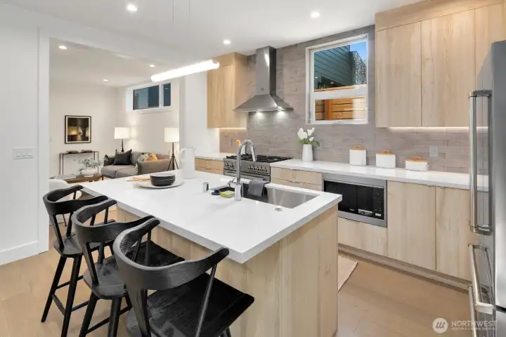 Efficient kitchen with eating space.