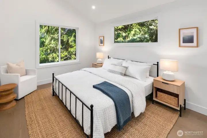 Vaulted ceilings in the upper level primary suite.