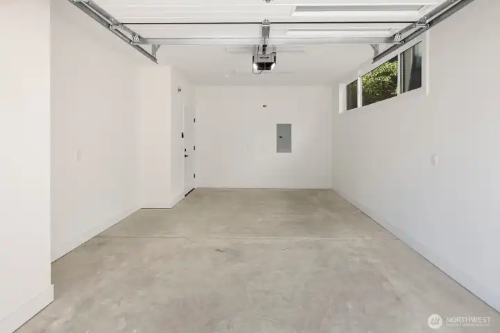 Carriage house has a fully finished 1-car garage.