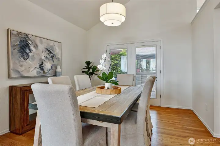 Formal dining room w/double french doors that open to the deck and back garden.