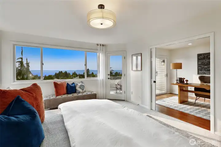 Views from your King bed in the primary bedroom, door to upper balcony, and attached room w/sliding french doors, great for a nursery or toddler room, or office!
