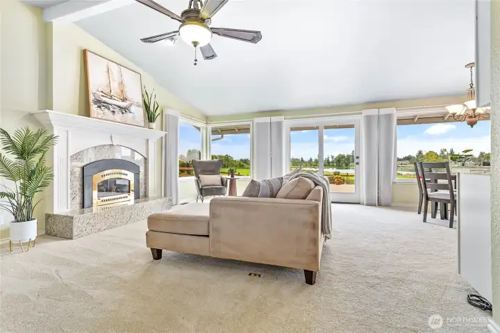 The living room has vaulted ceilings and a gas fireplace.