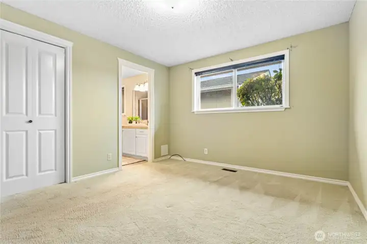 Primary Bedroom with walk in closet and attached 3/4 bathroom.