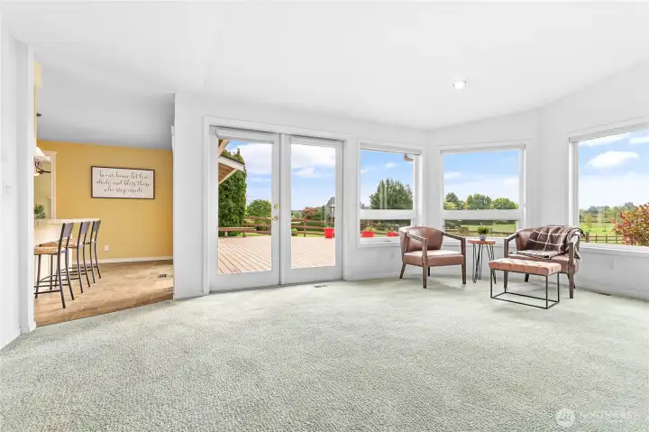 The large back deck can be accessed from the Living Room, Kitchen, and the Family Room.