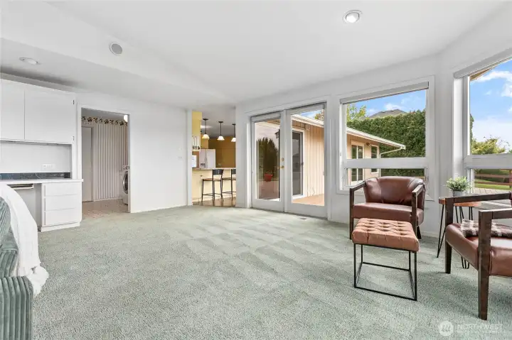 The opening on the left leads to a 3/4 bathroom, utility room, and the garage.