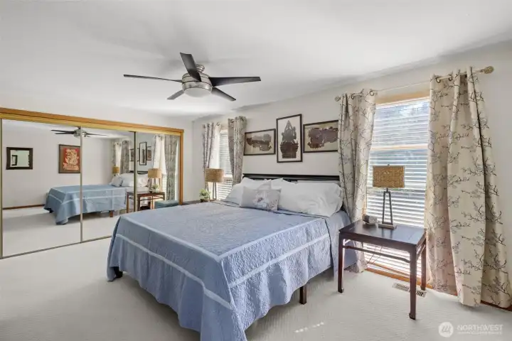 Mirrored closets and ceiling fan.