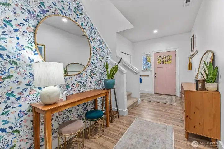 Custom Entry Way, LPV flooring and an adorable interior pink door!