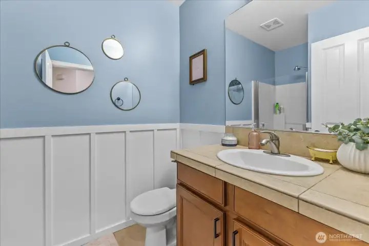 3/4 bathroom downstairs across from Main level bedroom - Stand up shower, toilet, sink