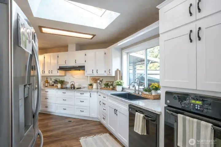 Expansive window invites sunlight to pour in, brightening the space.