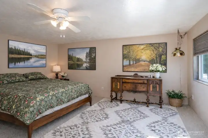 The primary suite offers ample room for a sitting area and offers a relaxing, personal retreat.