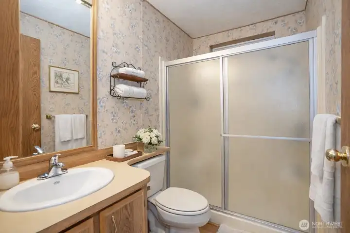 Serene bathroom with floral accents.