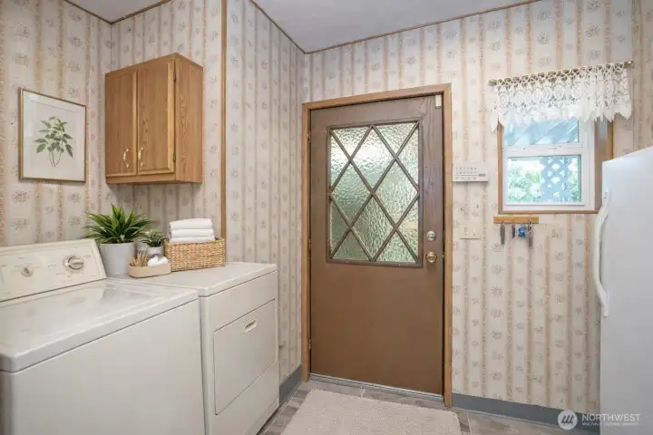 Another laundry room view out to the great outdoors.