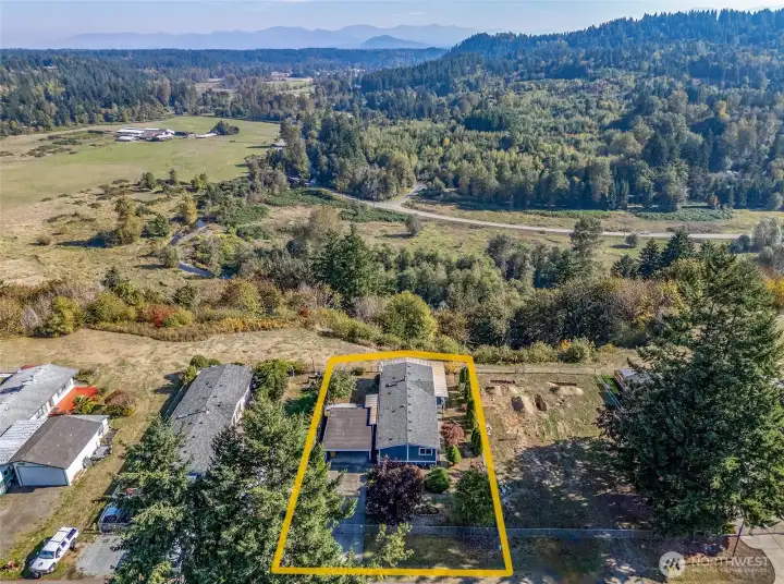 Aerial view capturing the property and its breathtaking scenery!