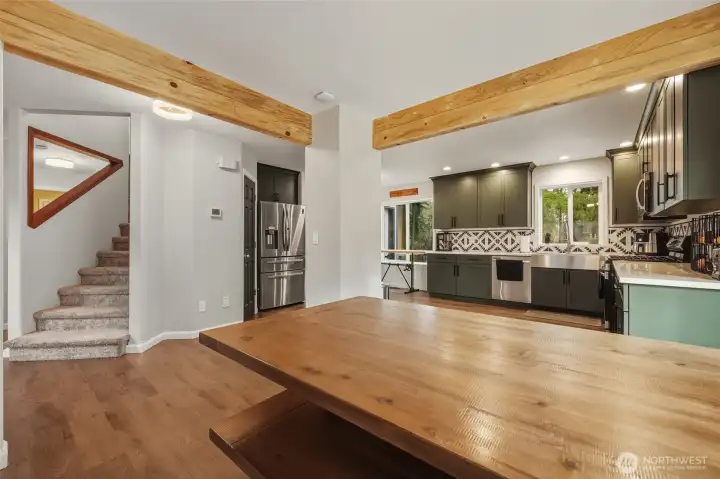 Another view of the open dining area shows adjacent kitchen.