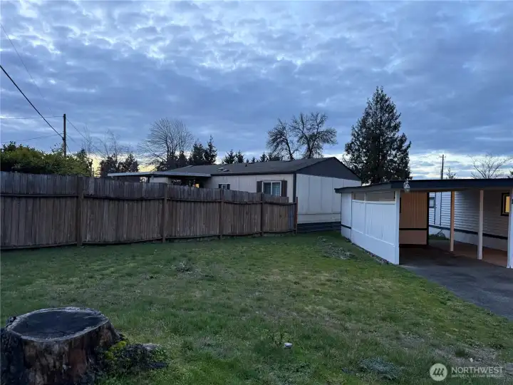 The side yard is larger due to this being a corner lot