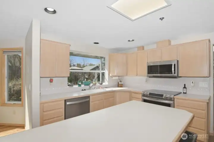 Kitchen  large island with eating space, Samsung chef collection  stainless steel appliances. Refrigerator, oven, dishwasher, and built in microwave. Walk in pantry, garden window, and breakfast nook.