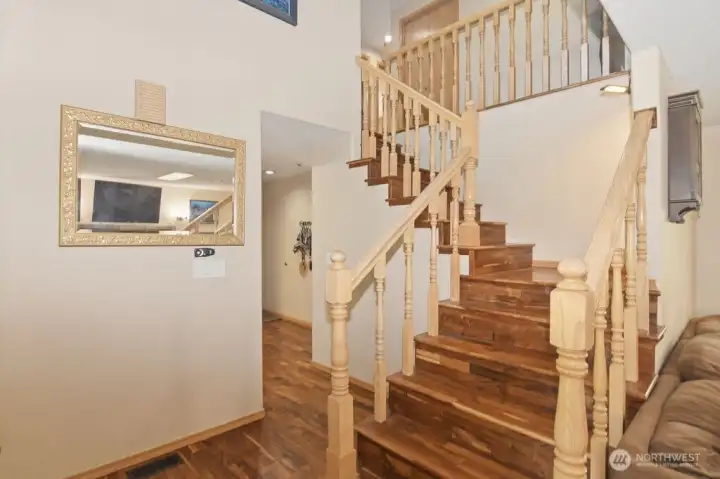 Hand-scraped acacia wood floors.