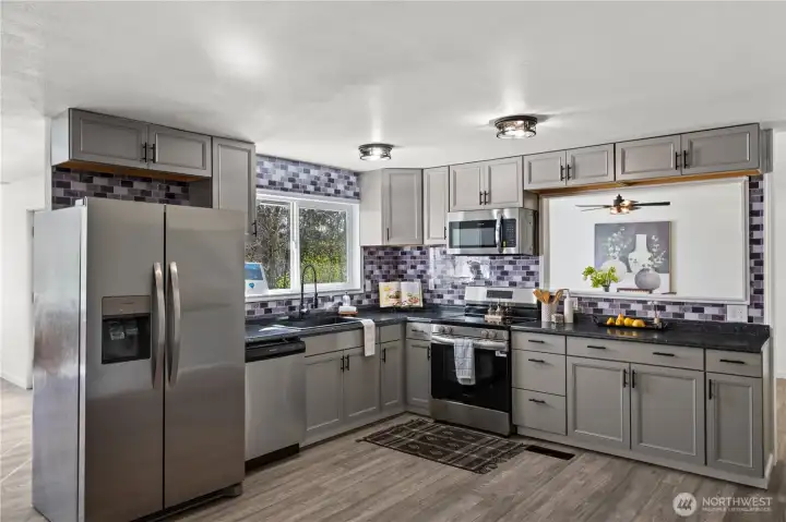 Brand new cabinets, countertops, and appliances.