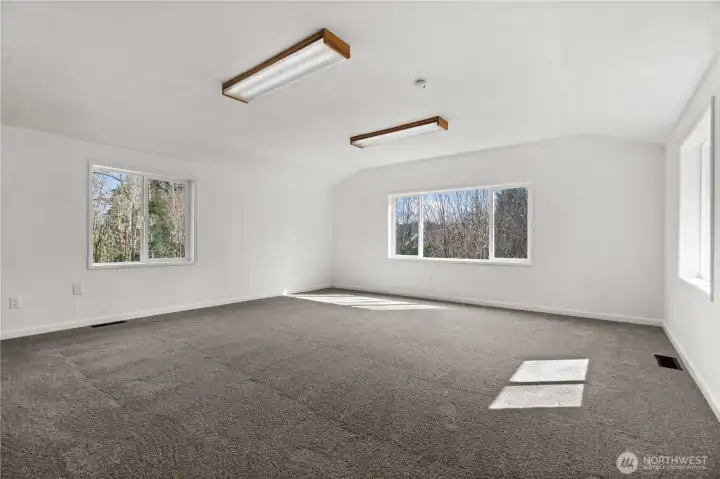 This room upstairs is massive with a walk-in closet to the left. Bonus room, junior suite... Let your vision take over this room.