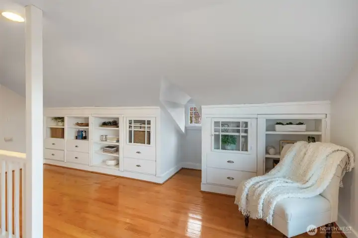 Go upstairs to the converted attic and enjoy the reading nook and storage