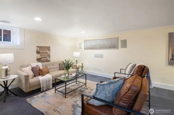 Large bonus room in the basement with surround sound system and lots of storage