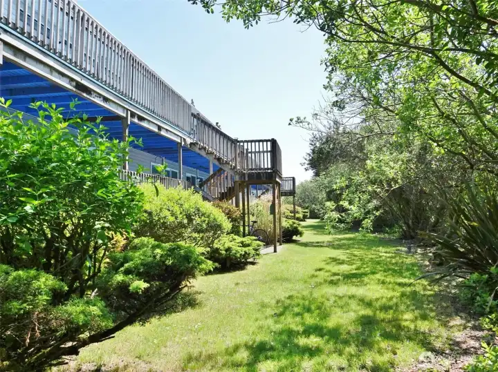 Ocean Surf building's privately situated backyard with mature landscaping.